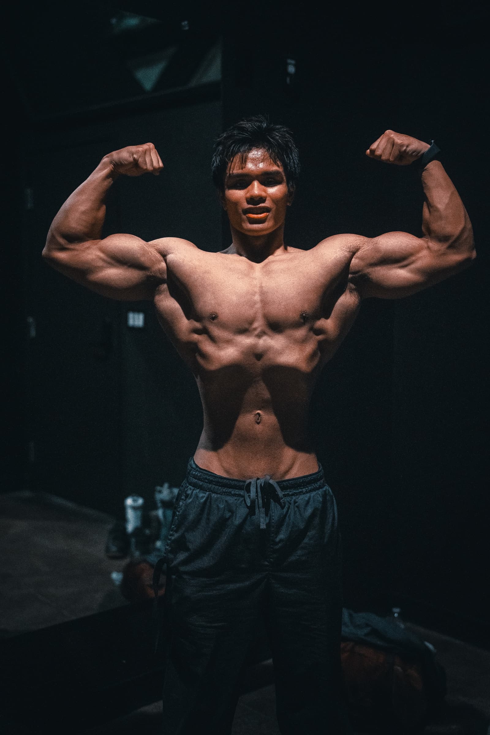 Athlete holding a front double-biceps pose