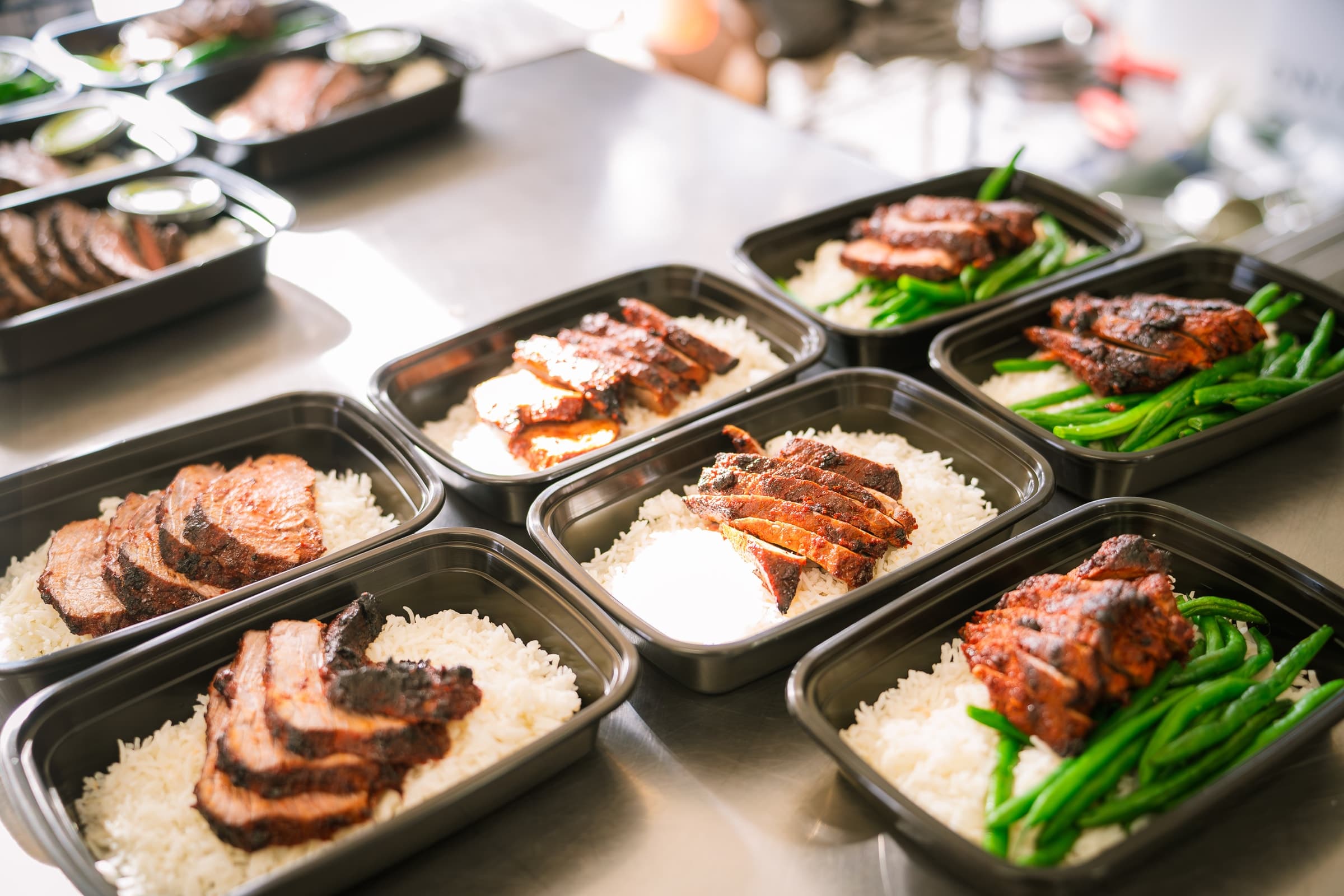 Prepared meals arranged across a restaurant counter